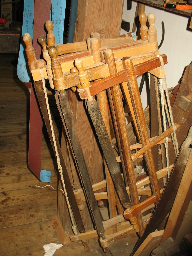 Traditional framesaw with tensioned blade – pre-industrial woodworking tool for ripping and crosscutting
