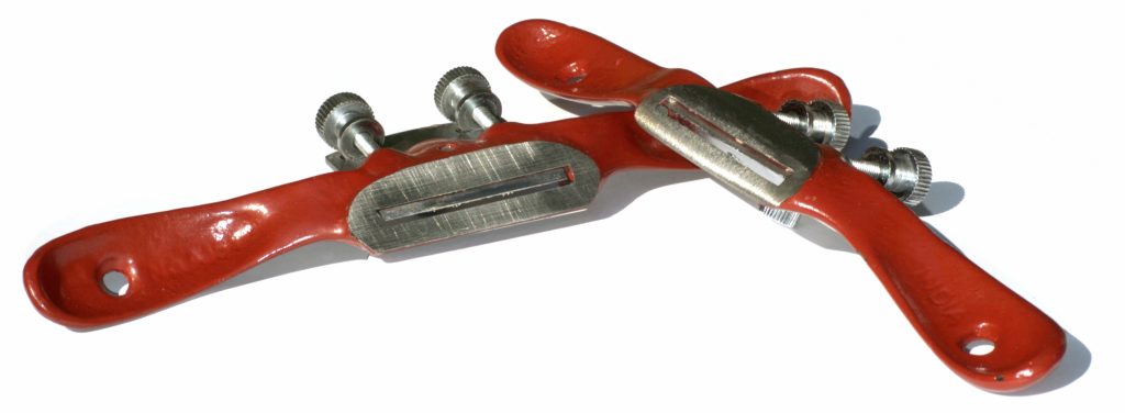 Standard and rounded spokeshave tools side by side – traditional woodworking planes for curved surfaces