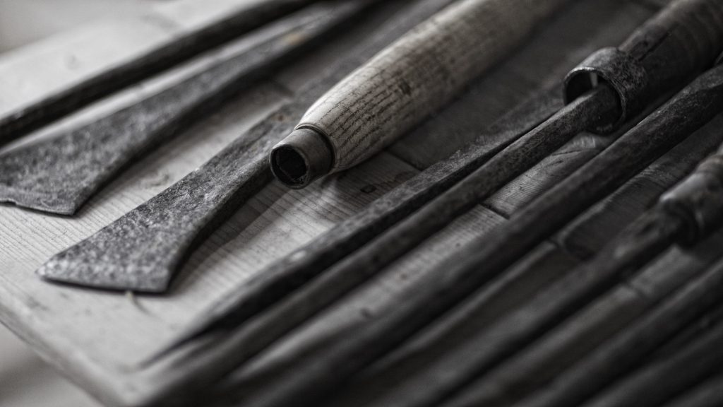 Chisels on display – historical iron chisels on a surface at Skokloster Castle, Sweden
