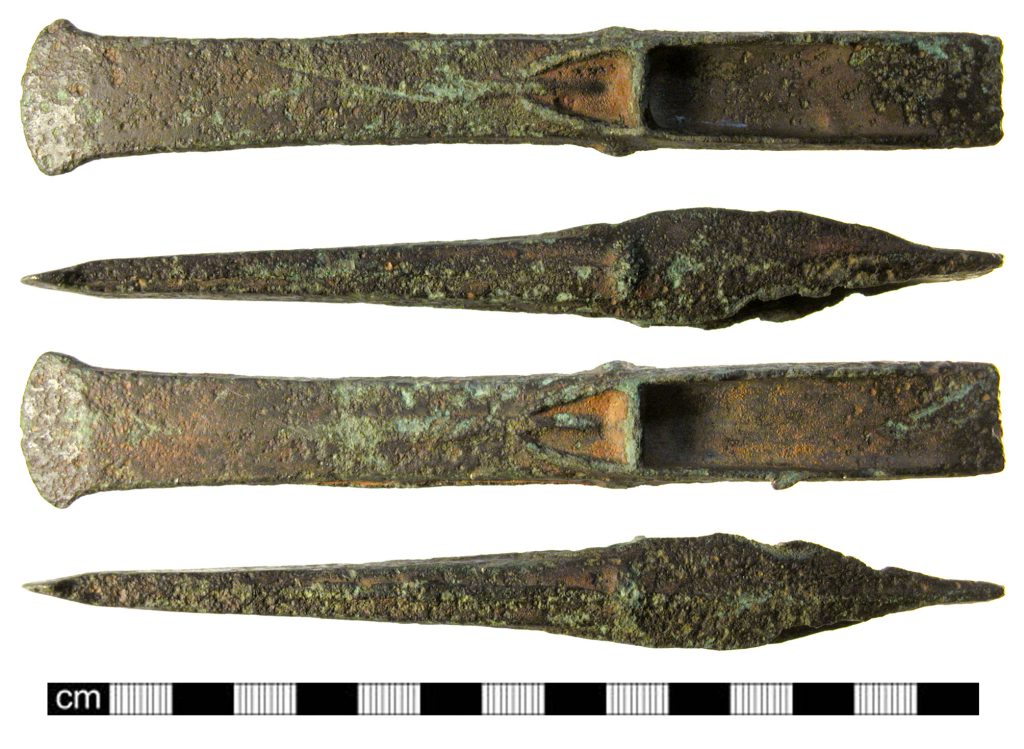 Mortise chisel – Bronze Age copper-alloy flanged chisel on plain background